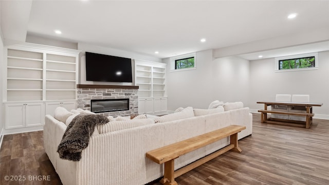 815 S Kingswood Ct, West Des Moines, IA 50266 - living room featuring wood finished floors, recessed lighting, a stone fireplace, and baseboards