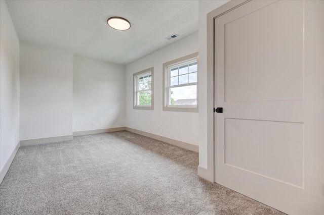 801 SE 5th St, Grimes, IA 50111 - spare room featuring carpet and baseboards