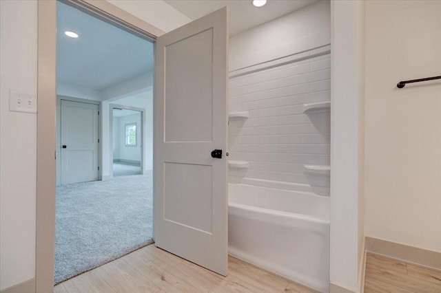 801 SE 5th St, Grimes, IA 50111 - bathroom featuring wood finished floors, recessed lighting, and bathtub / shower combination
