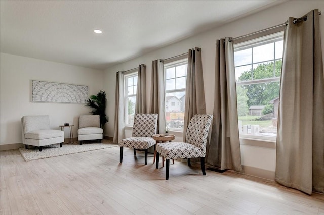 801 SE 5th St, Grimes, IA 50111 - living area featuring light wood-style floors, recessed lighting, and baseboards