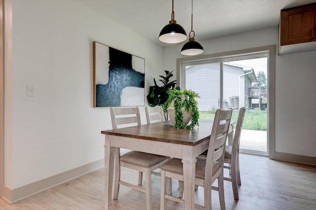801 SE 5th St, Grimes, IA 50111 - dining space featuring light wood-style flooring and baseboards