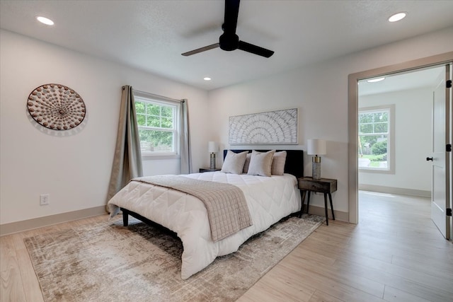 801 SE 5th St, Grimes, IA 50111 - bedroom with light wood-style floors, recessed lighting, baseboards, and ceiling fan