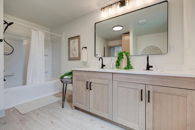 801 SE 5th St, Grimes, IA 50111 - full bathroom featuring double vanity, shower / tub combo with curtain, and wood finished floors