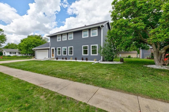 801 SE 5th St, Grimes, IA 50111 - colonial-style house featuring an attached garage, concrete driveway, and a front lawn