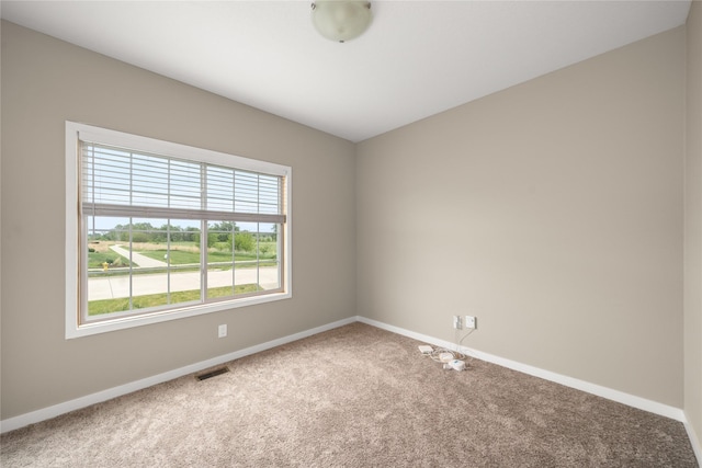 9334 Valley Pkwy, Johnston, IA 50131 - spare room featuring carpet flooring and baseboards