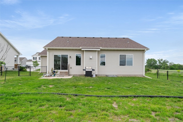 9334 Valley Pkwy, Johnston, IA 50131 - back of property featuring entry steps, a gate, and a shingled roof