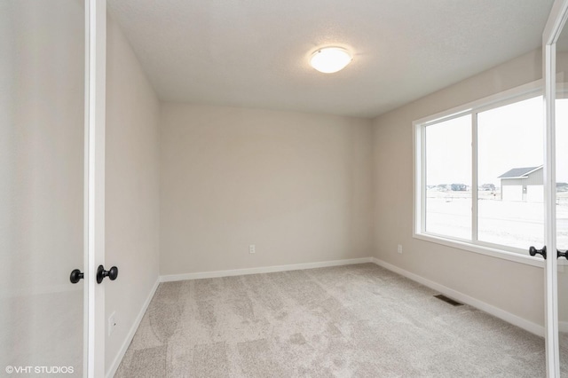 2925 6th Ave SW, Altoona, IA 50009 - empty room featuring light colored carpet and baseboards
