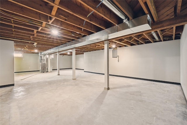 204 W Washington St, Montezuma, IA 50171 - basement featuring heating unit and baseboards
