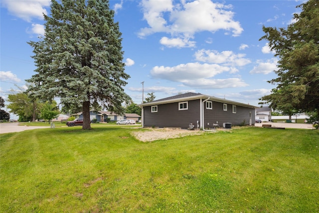 204 W Washington St, Montezuma, IA 50171 - view of side of property with a yard and cooling unit
