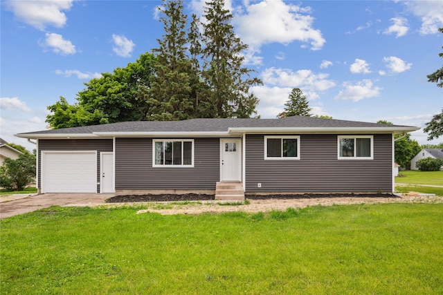 204 W Washington St, Montezuma, IA 50171 - ranch-style house featuring a garage, a front yard, entry steps, and driveway