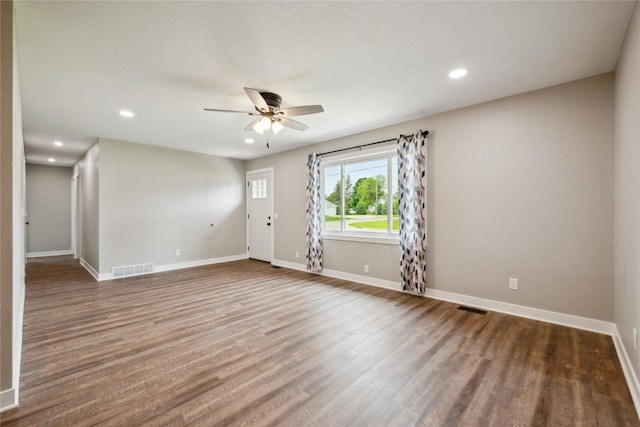 204 W Washington St, Montezuma, IA 50171 - spare room featuring a ceiling fan, wood finished floors, recessed lighting, and baseboards