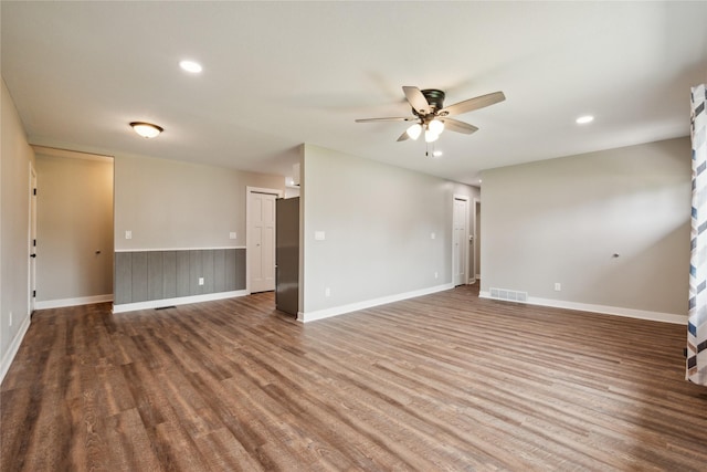 204 W Washington St, Montezuma, IA 50171 - spare room with a ceiling fan, wood finished floors, recessed lighting, and baseboards