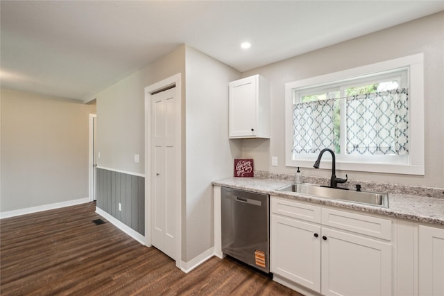 204 W Washington St, Montezuma, IA 50171 - kitchen with stainless steel dishwasher, a sink, dark wood finished floors, white cabinets, and baseboards