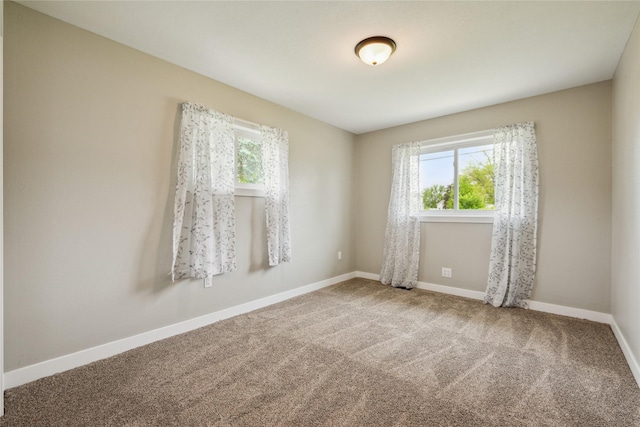 204 W Washington St, Montezuma, IA 50171 - carpeted spare room featuring healthy amount of natural light and baseboards