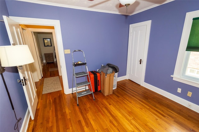 1055 40th St, Des Moines, IA 50311 - misc room with wood finished floors, ceiling fan, baseboards, and ornamental molding