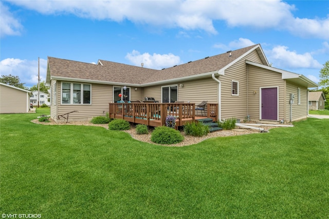 408 W 13th St N, Newton, IA 50208 - rear view of house featuring a deck, a lawn, and roof with shingles