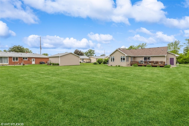 408 W 13th St N, Newton, IA 50208 - view of green lawn with a wooden deck