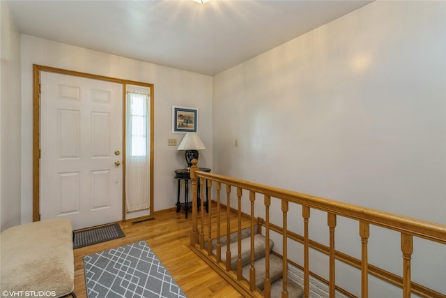 408 W 13th St N, Newton, IA 50208 - foyer entrance with light wood finished floors and stairs