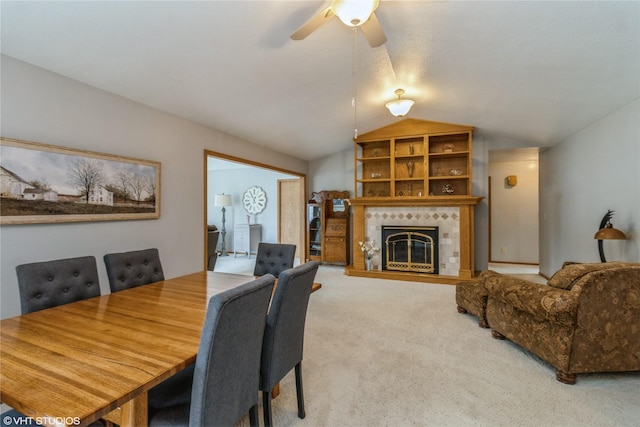 408 W 13th St N, Newton, IA 50208 - dining room featuring carpet flooring, vaulted ceiling, a ceiling fan, and a tiled fireplace