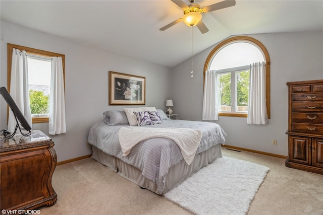 408 W 13th St N, Newton, IA 50208 - bedroom featuring light colored carpet, lofted ceiling, baseboards, and ceiling fan