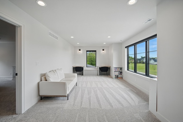 1004 NW Hugg Dr, Polk City, IA 50226 - sitting room with carpet floors, recessed lighting, and baseboards