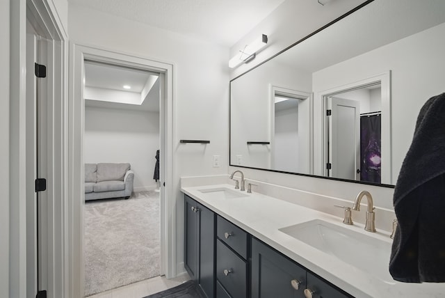 1004 NW Hugg Dr, Polk City, IA 50226 - bathroom featuring double vanity and baseboards