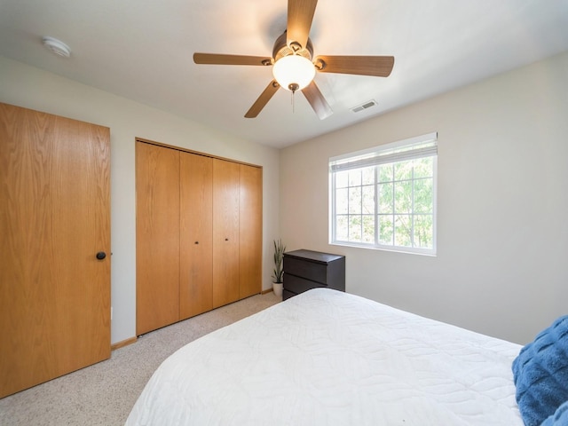 1355 SE 6th St Unit 301, Grimes, IA 50111 - bedroom with carpet, a closet, ceiling fan, and baseboards