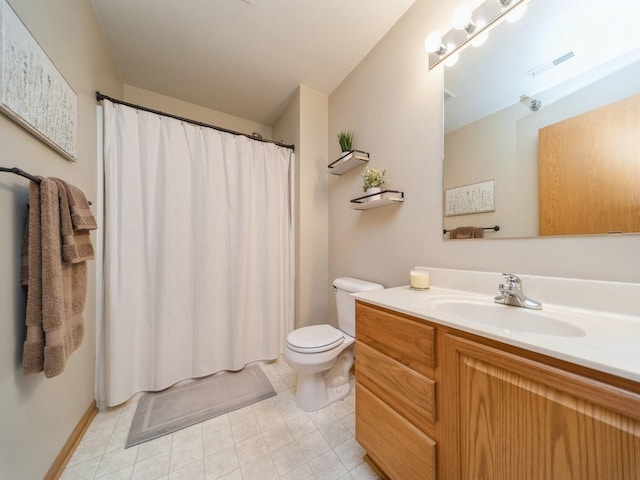 1355 SE 6th St Unit 301, Grimes, IA 50111 - full bath featuring vanity, toilet, a shower with curtain, baseboards, and tile patterned floors