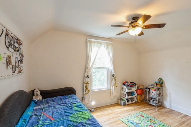 140 N 7th St, Carlisle, IA 50047 - bedroom featuring lofted ceiling, wood finished floors, ceiling fan, and baseboards