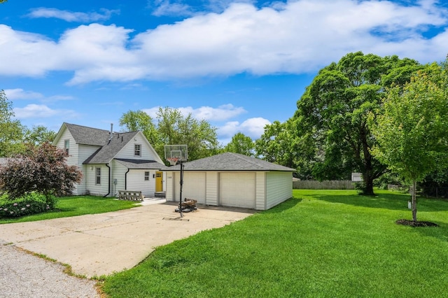 140 N 7th St, Carlisle, IA 50047 - rear view of property featuring a garage, an outdoor structure, and a yard