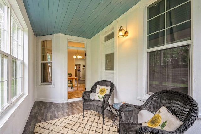 140 N 7th St, Carlisle, IA 50047 - sunroom with plenty of natural light and a chandelier