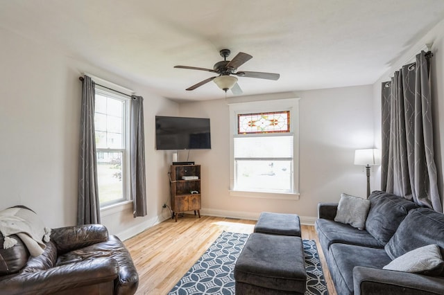 140 N 7th St, Carlisle, IA 50047 - living area with a ceiling fan, light wood-style flooring, and baseboards