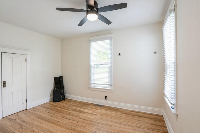140 N 7th St, Carlisle, IA 50047 - unfurnished room with light wood-type flooring, baseboards, and a ceiling fan