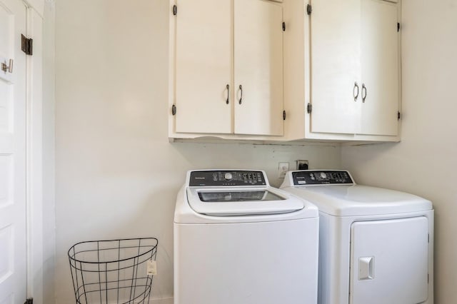 140 N 7th St, Carlisle, IA 50047 - washroom with washer and dryer and cabinet space