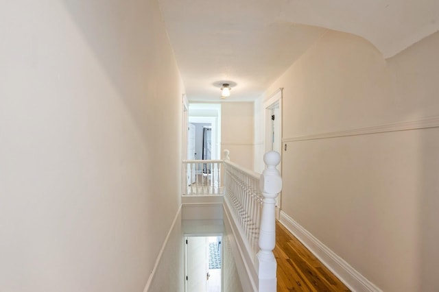 140 N 7th St, Carlisle, IA 50047 - hall with an upstairs landing, wood finished floors, and baseboards