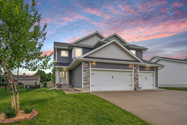 603 Elm Ct, Dallas Center, IA 50063 - traditional-style house featuring concrete driveway, an attached garage, and stone siding