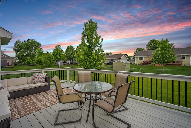 603 Elm Ct, Dallas Center, IA 50063 - wooden terrace featuring an outdoor living space, a fenced backyard, and outdoor dining space