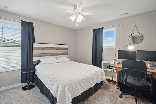 603 Elm Ct, Dallas Center, IA 50063 - bedroom with carpet, a ceiling fan, and a desk