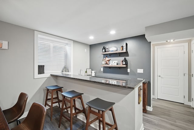 603 Elm Ct, Dallas Center, IA 50063 - indoor wet bar featuring light wood-style flooring and recessed lighting