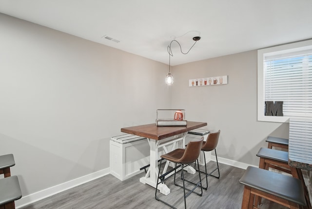 603 Elm Ct, Dallas Center, IA 50063 - dining area featuring wood finished floors and baseboards