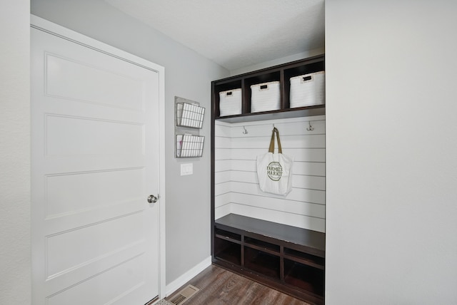 603 Elm Ct, Dallas Center, IA 50063 - mudroom featuring dark wood-type flooring and baseboards