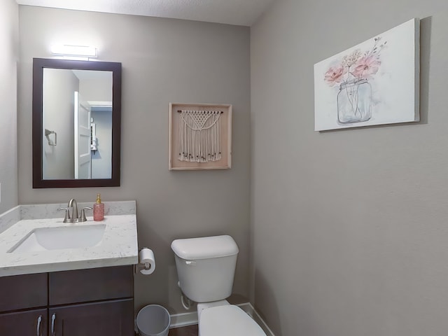 603 Elm Ct, Dallas Center, IA 50063 - half bath featuring toilet and vanity