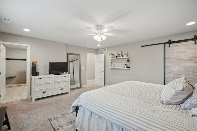 603 Elm Ct, Dallas Center, IA 50063 - bedroom featuring a barn door, light carpet, recessed lighting, a ceiling fan, and connected bathroom
