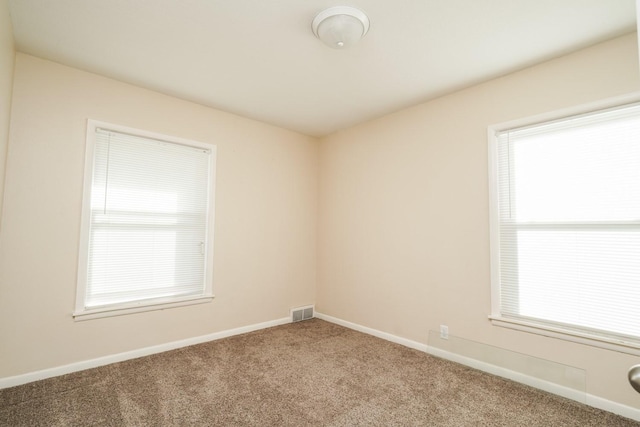 1617 Evergreen Ave, Des Moines, IA 50320 - spare room with carpet and baseboards