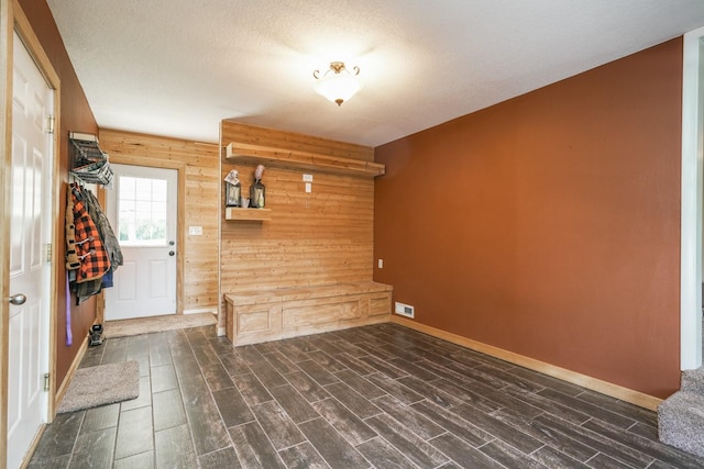 1617 Evergreen Ave, Des Moines, IA 50320 - foyer with baseboards, wooden walls, and wood tiled floors