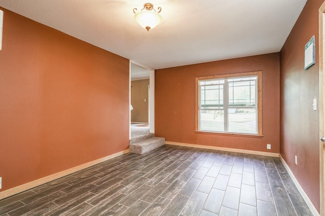 1617 Evergreen Ave, Des Moines, IA 50320 - empty room featuring dark wood finished floors and baseboards