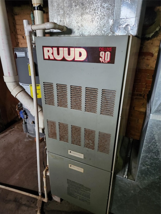 414 E Robinson St, Knoxville, IA 50138 - utility room featuring heating unit