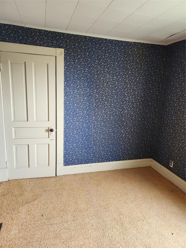 414 E Robinson St, Knoxville, IA 50138 - view of carpeted spare room