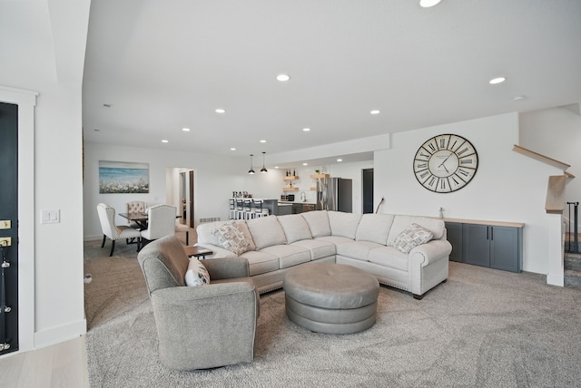 2216 Timberview Dr, Norwalk, IA 50211 - living room with recessed lighting, bar area, baseboards, and light colored carpet