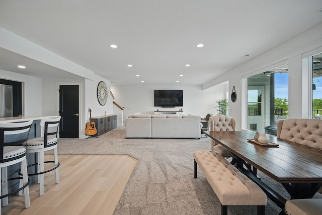 2216 Timberview Dr, Norwalk, IA 50211 - living room with recessed lighting, light wood-style flooring, and light colored carpet